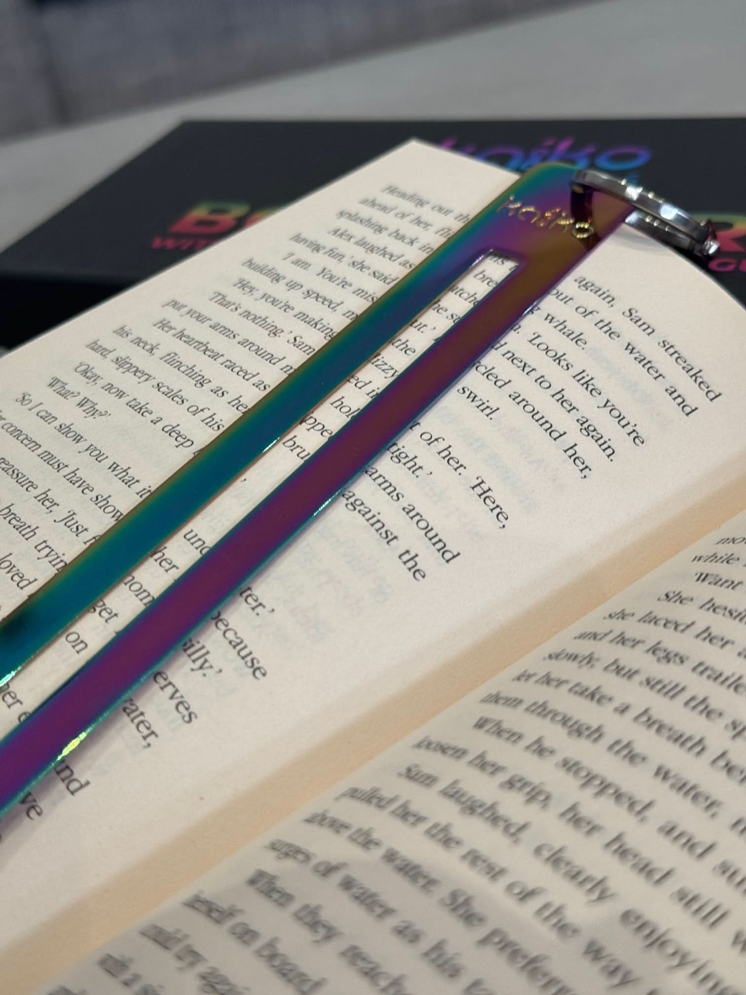 Kaiko Fidgets metal bookmark in oil slick finish with reading guide pane and fidget hook for sensory focus aid - view 15