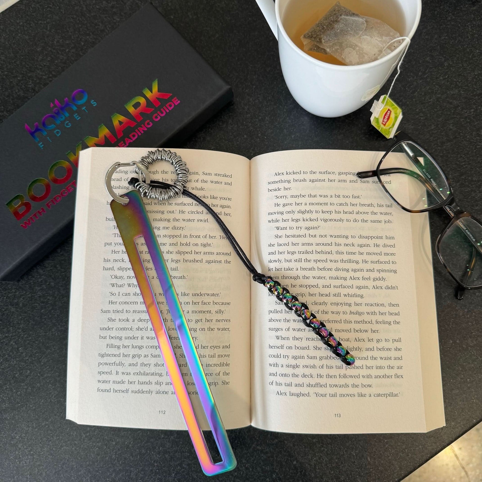 Kaiko Fidgets metal bookmark in oil slick finish with reading guide pane and fidget hook for sensory focus aid - view 7