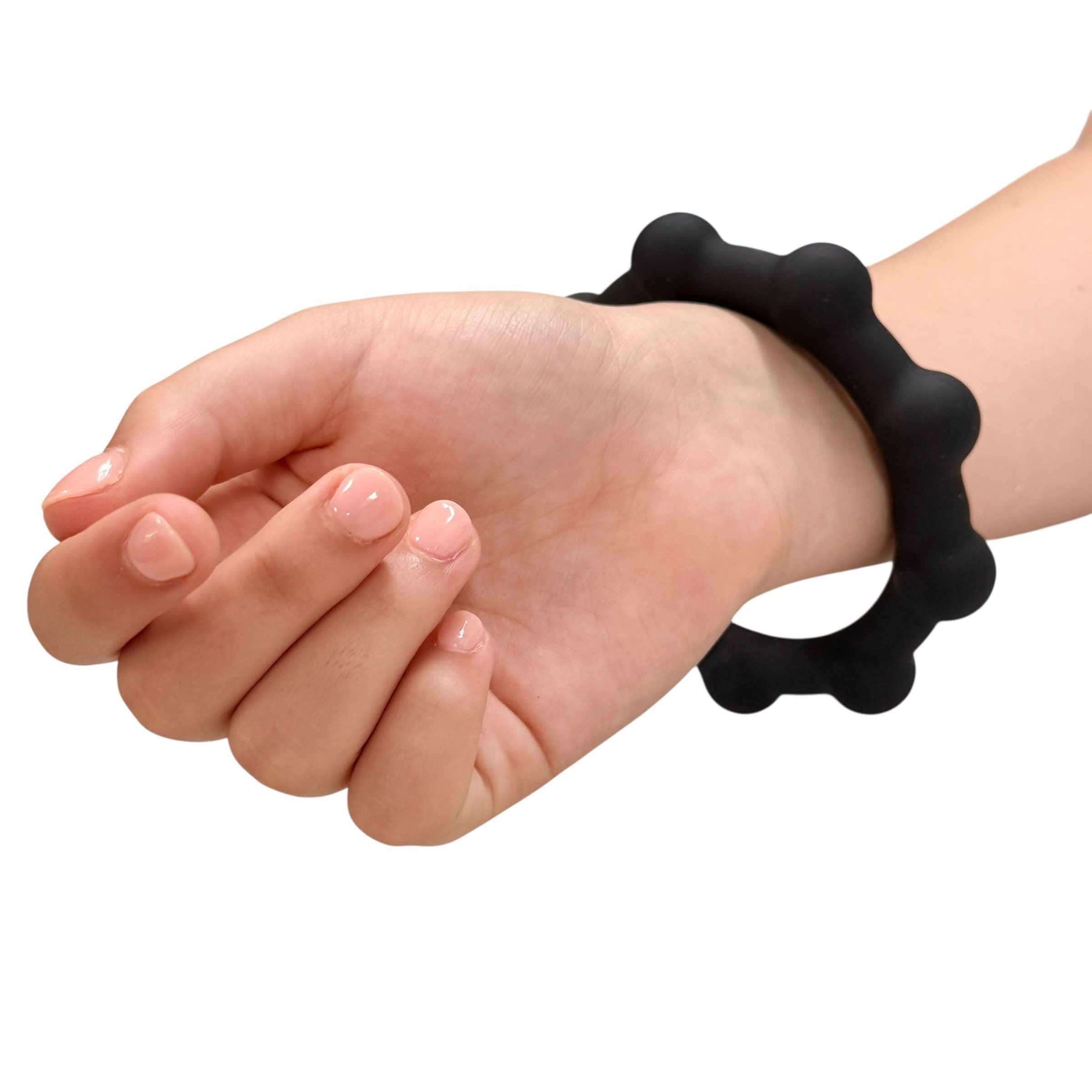 Kaiko Octopop Large Black wearable sensory fidget with 8 tactile nodes and 7 internal beads