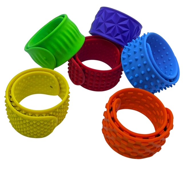 Kaiko Fidgets vibrant silicone sensory slap bands in six textured patterns worn on wrist for tactile sensory support - view 10