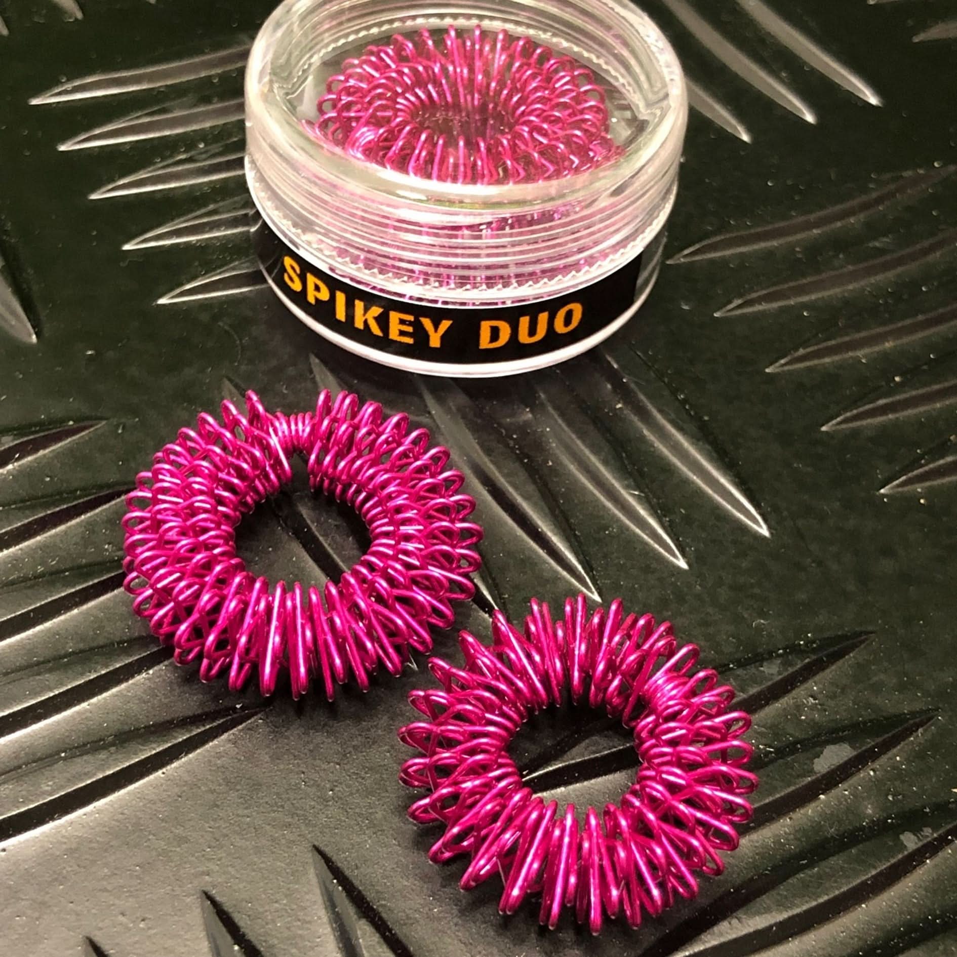 Kaiko Finger Spikey Duo fuchsia set with standard and tighter spikey rings for sensory regulation and fidgeting