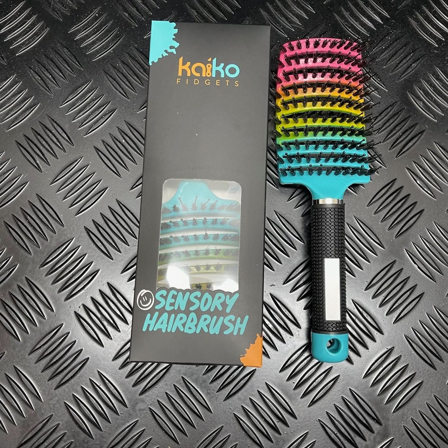 Kaiko Sensory Hairbrush with rainbow design providing soothing tactile stimulation for kids