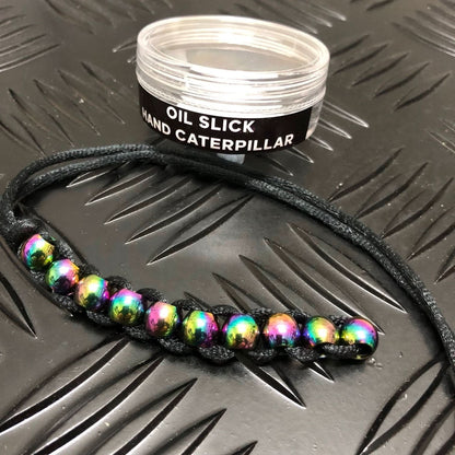 Kaiko Hand Caterpillar Fidget in Oil Slick finish showing colourful chain links for sensory focus and balance